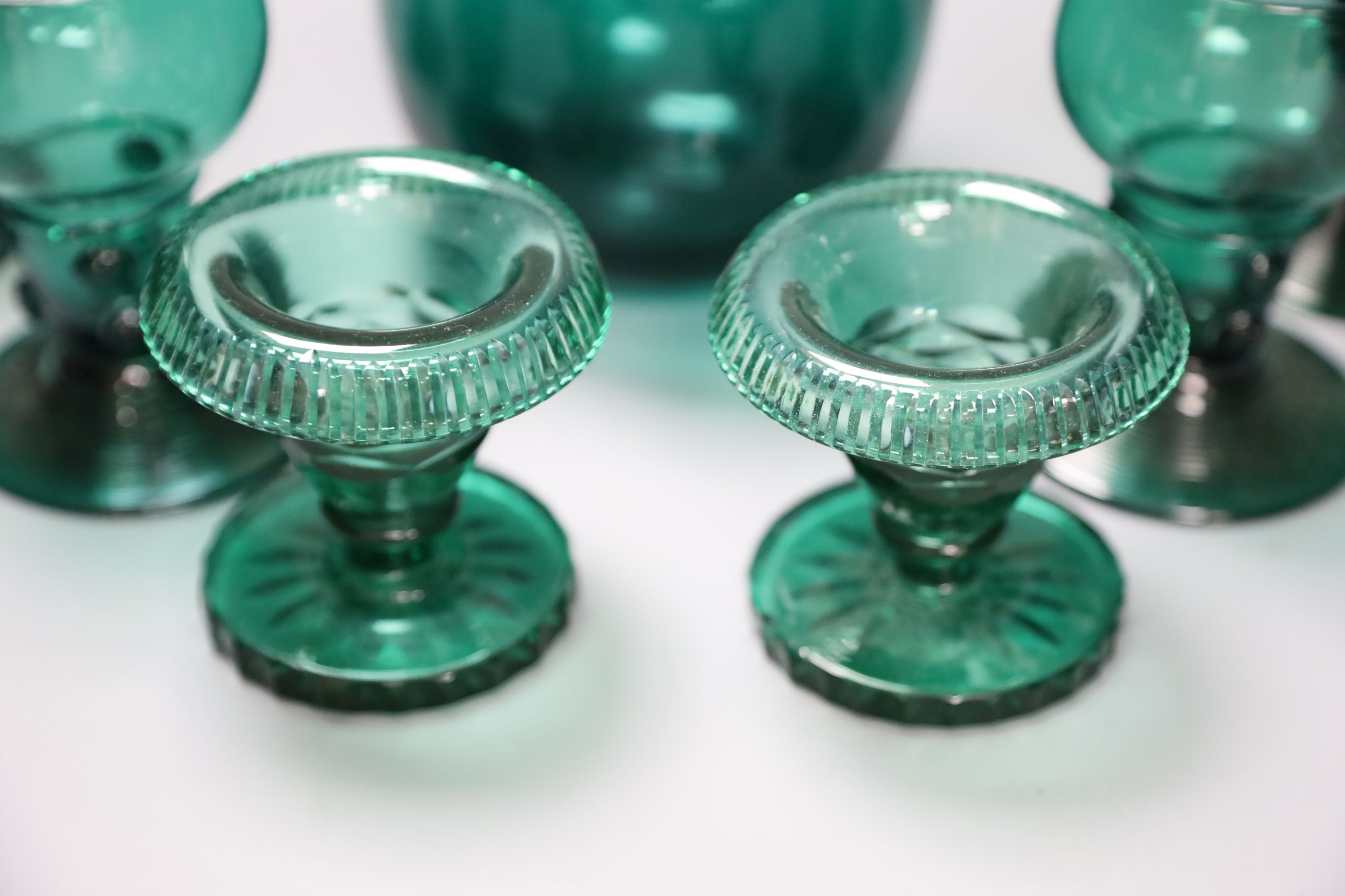 A group of 19th century green glass and a Victorian dump paperweight